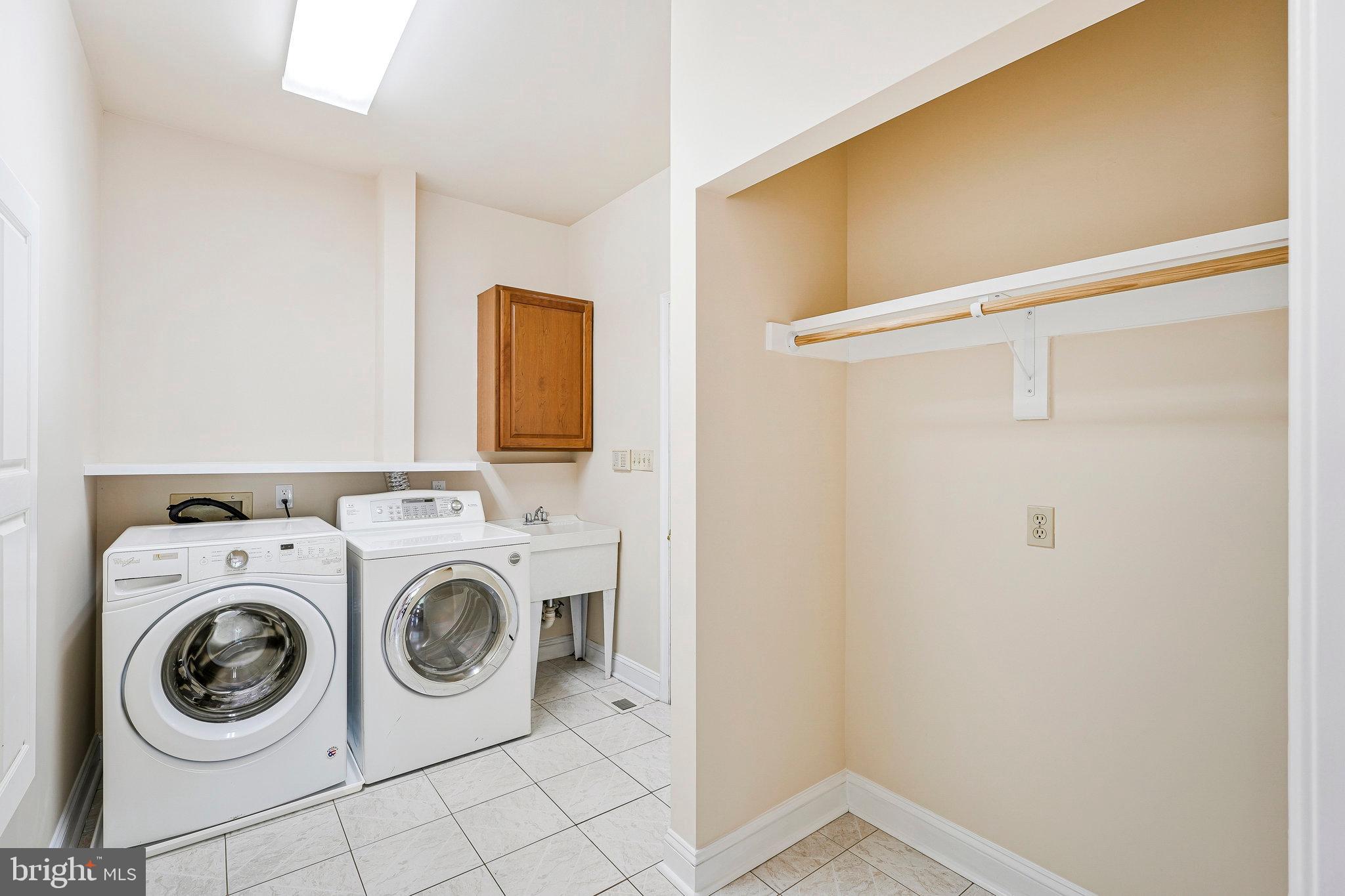 8652 Tuttle Road Springfield, VA 22152 - Photo 51 of 102 a utility room with dryer and washer