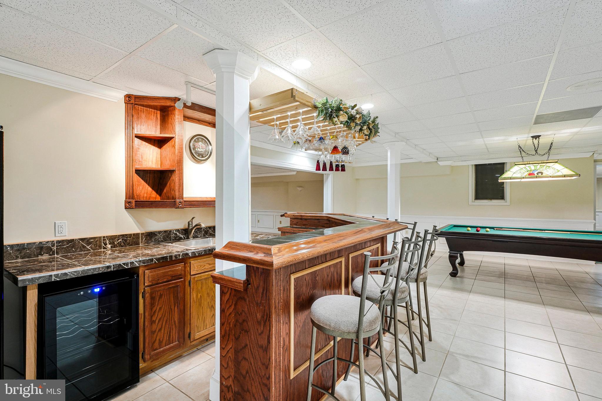 8652 Tuttle Road Springfield, VA 22152 - Photo 59 of 102 a kitchen with a stove a sink and a refrigerator