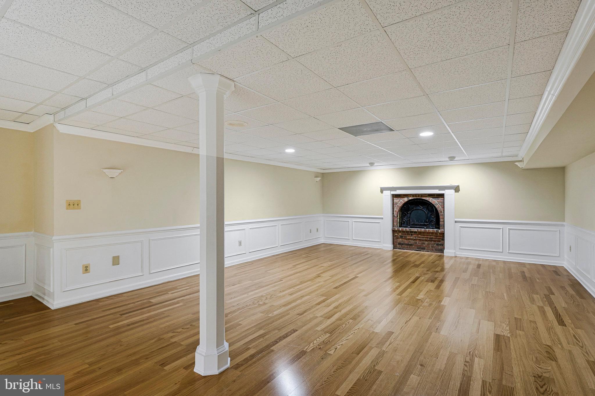 8652 Tuttle Road Springfield, VA 22152 - Photo 65 of 102 a view of empty room with wooden floor