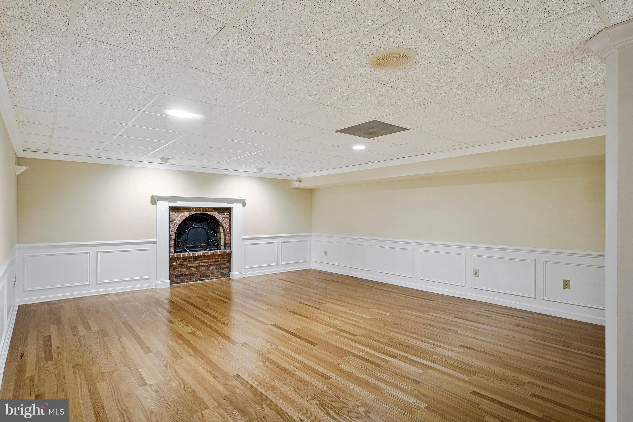 8652 Tuttle Road Springfield, VA 22152 - Photo 66 of 102 a view of empty room with wooden floor and fan