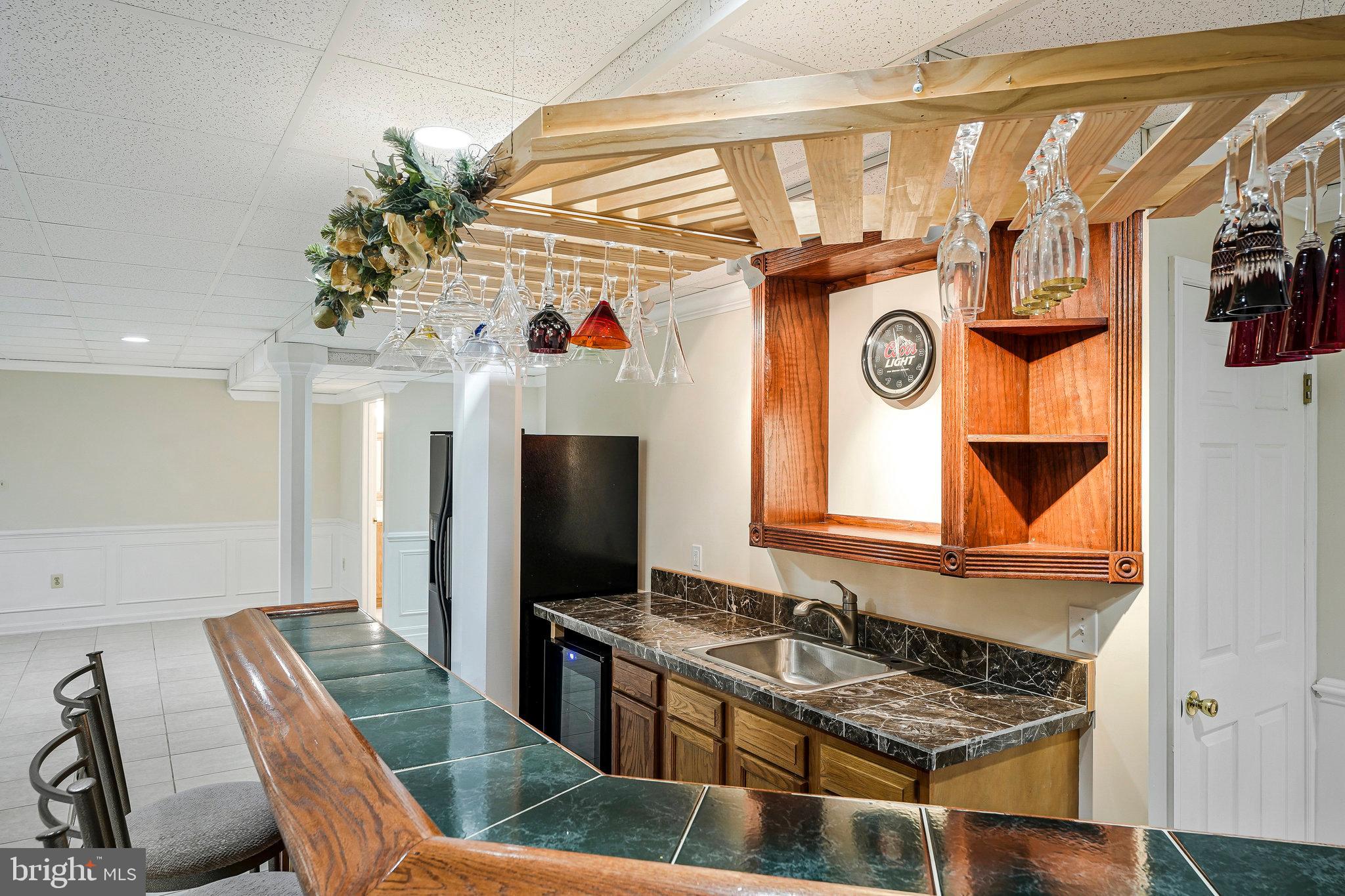 8652 Tuttle Road Springfield, VA 22152 - Photo 80 of 102 a kitchen with stainless steel appliances granite countertop a sink and a refrigerator