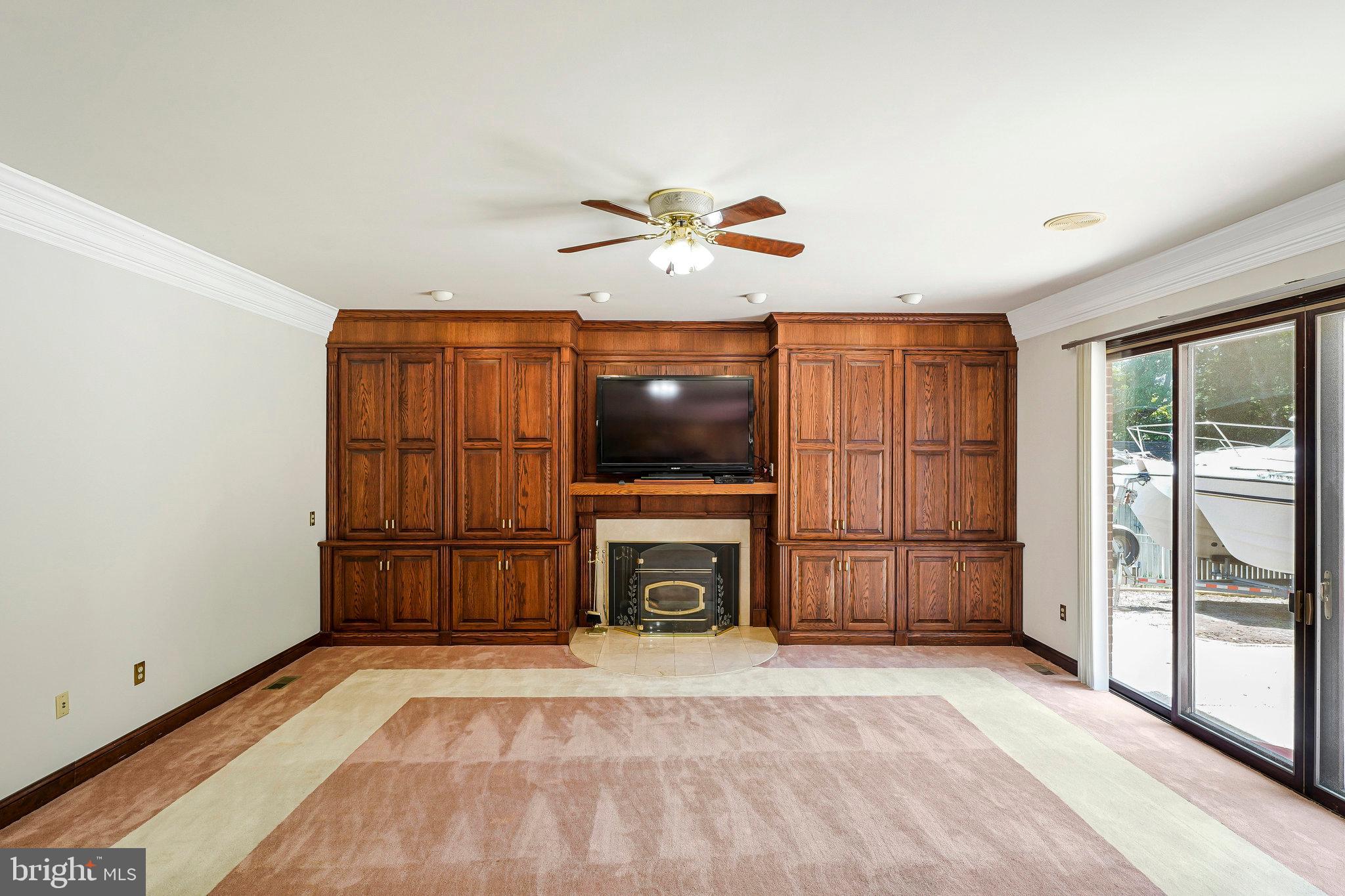 8652 Tuttle Road Springfield, VA 22152 - Photo 8 of 102 a living room with furniture and a flat screen tv