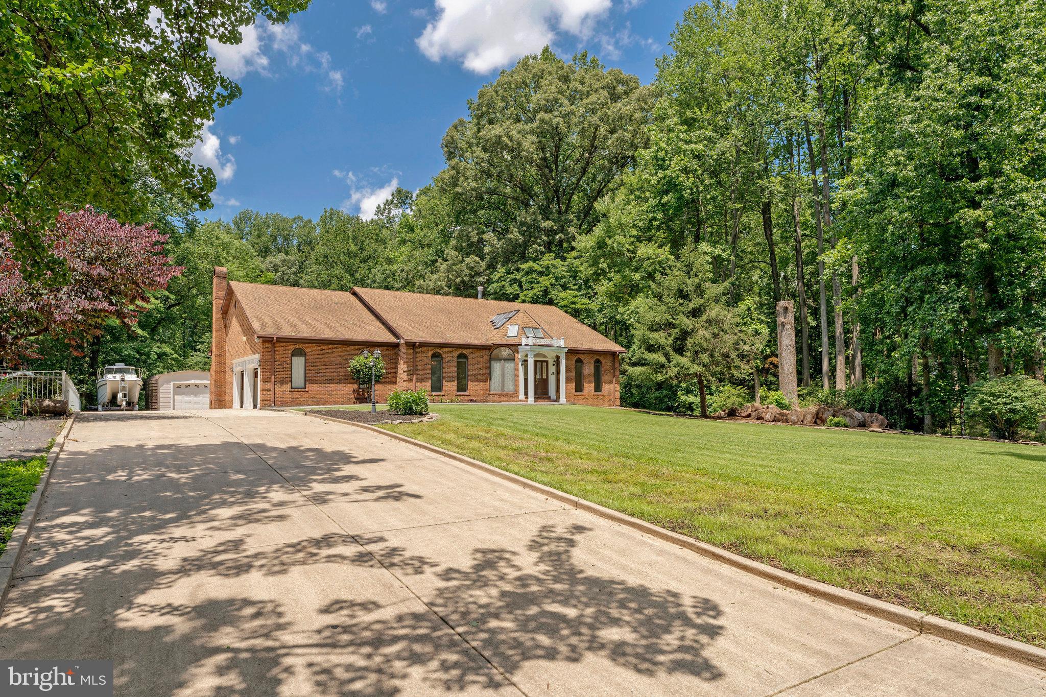 8652 Tuttle Road Springfield, VA 22152 - Photo 97 of 102 a view of a house with a yard