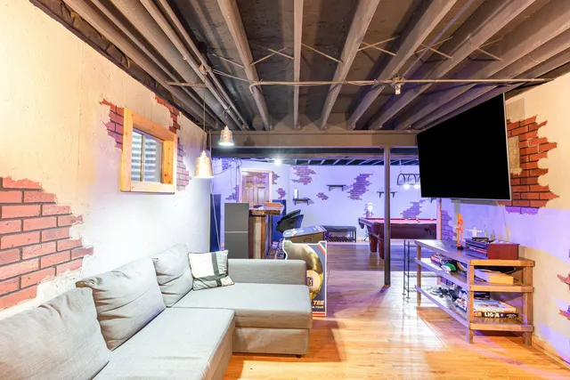 a living room with furniture and a flat screen tv