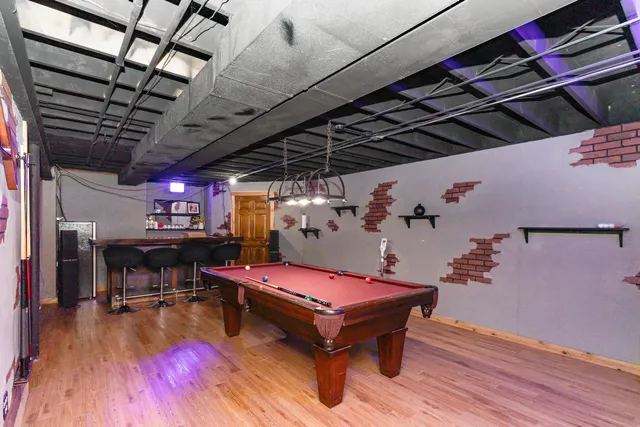 a room with furniture and pool table