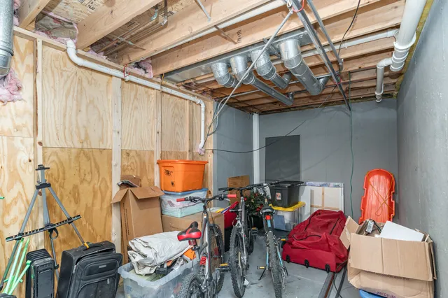 a view of a house with a yard and a garage