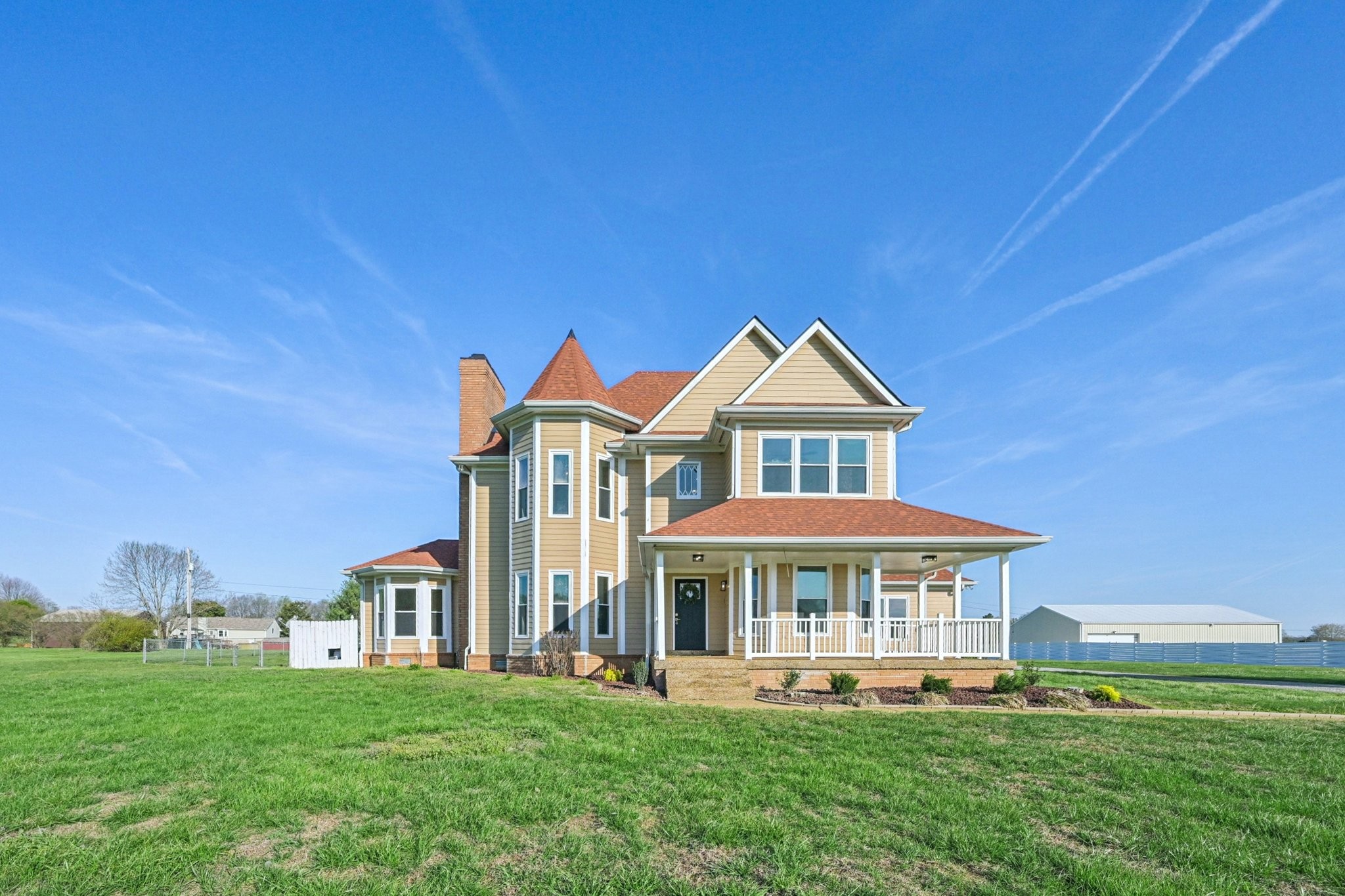 3032 Highway 49 Pleasant View, TN 37146 - Photo 1 of 19 a front view of a house with a yard