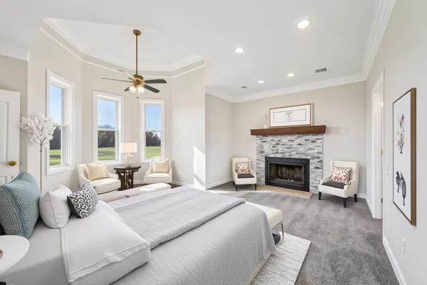 3032 Highway 49 Pleasant View, TN 37146 - Photo 11 of 19 a spacious bedroom with a large bed and a fireplace