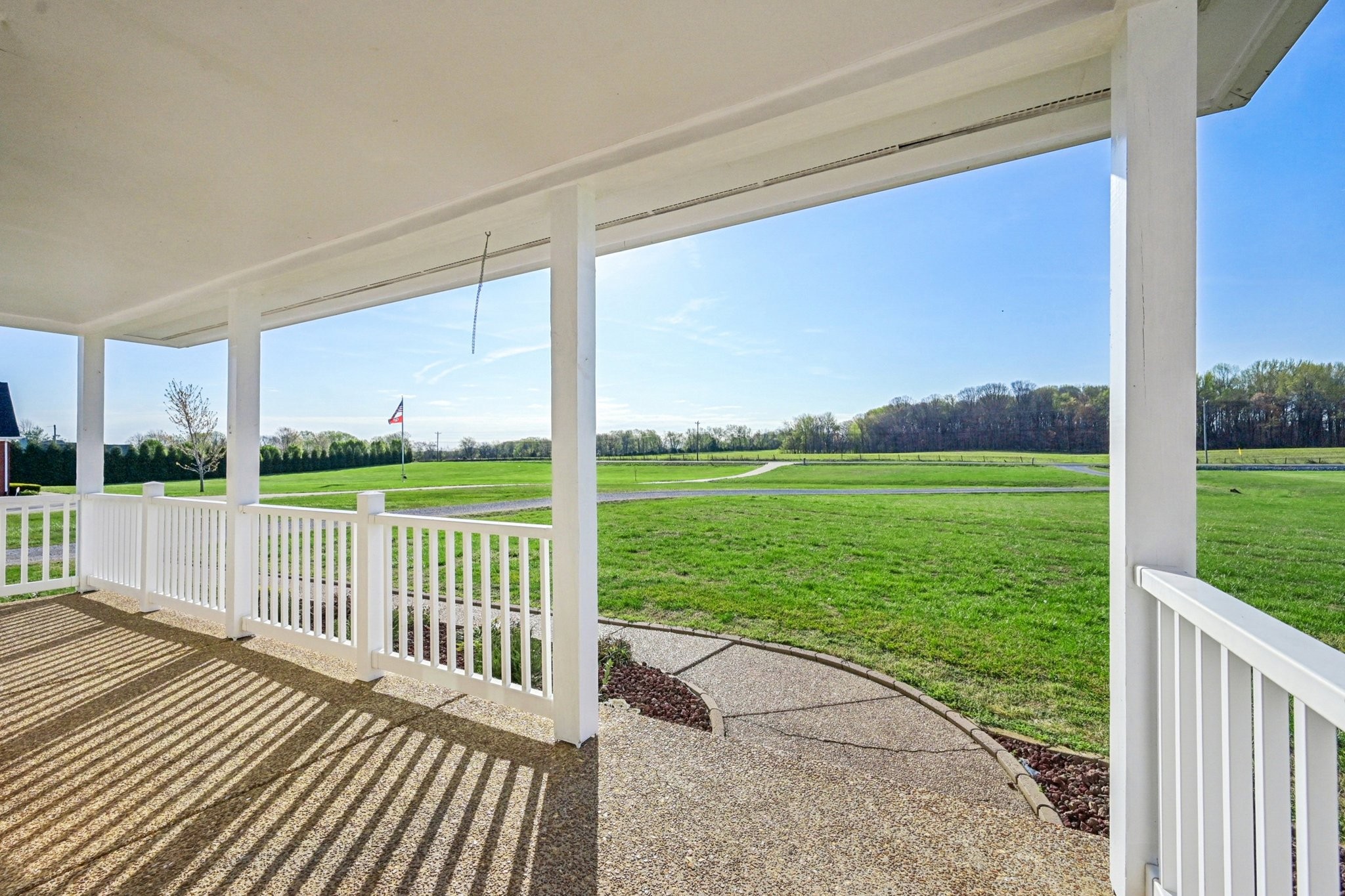 3032 Highway 49 Pleasant View, TN 37146 - Photo 3 of 19 a view of a deck with a big yard potted plants and large tree