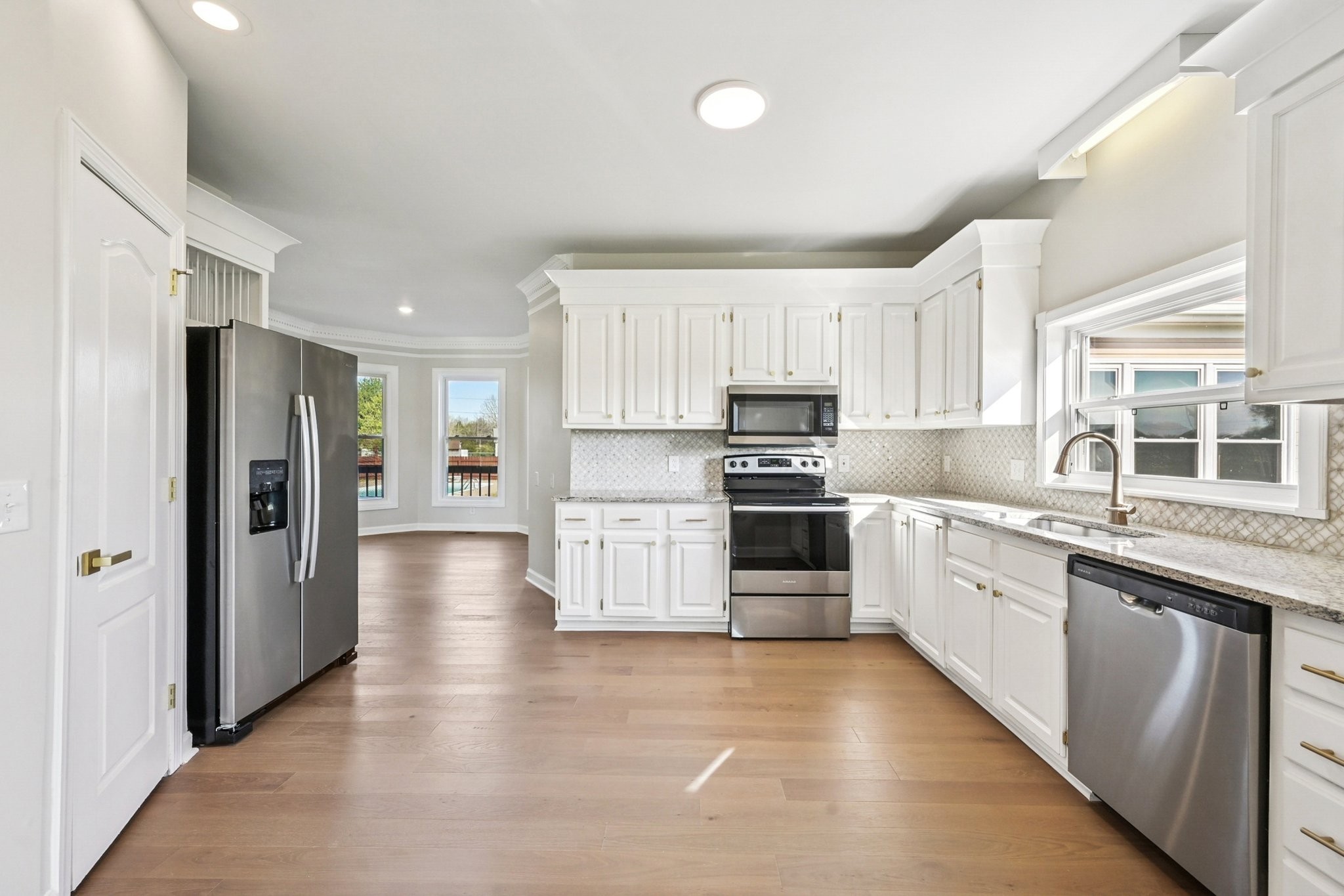 3032 Highway 49 Pleasant View, TN 37146 - Photo 6 of 19 a large kitchen with cabinets and stainless steel appliances