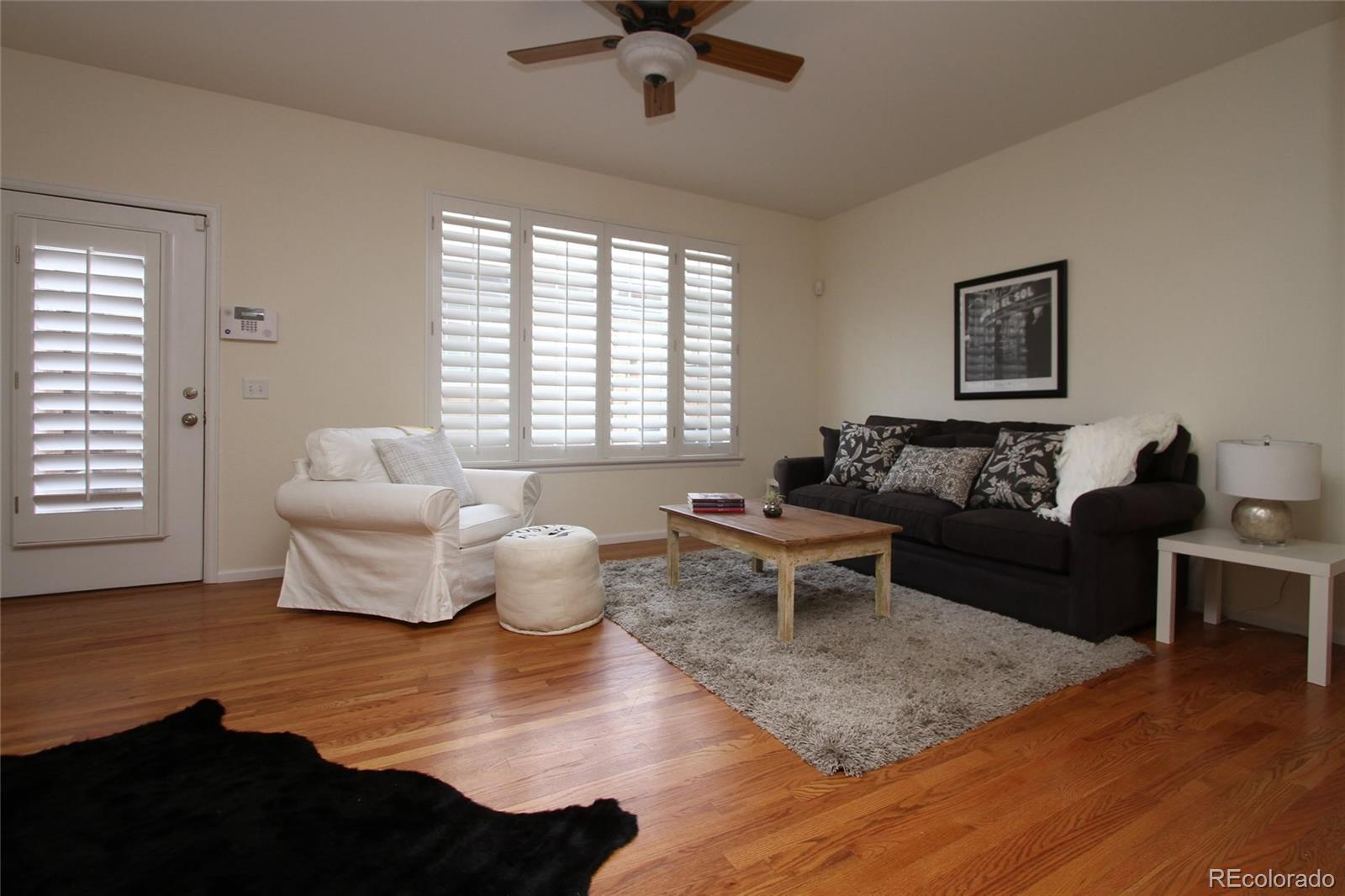 9489 Cedarhurst Lane, Unit B Highlands Ranch, CO 80129 - Photo 6 of 20 a living room with furniture and a window