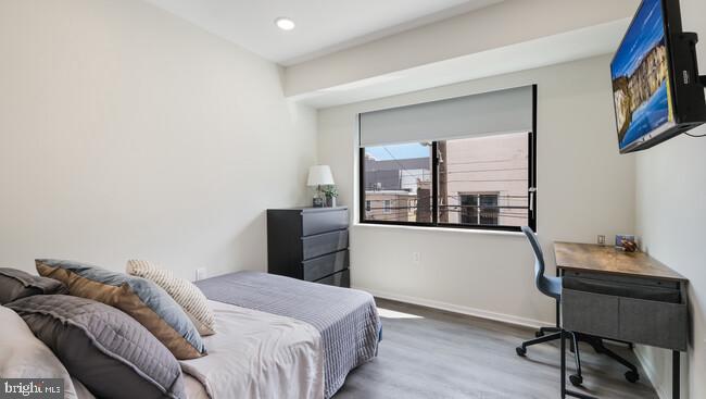 4415 Chestnut Street, Unit 210 Philadelphia, PA 19104 - Photo 2 of 8 a bedroom with a bed and a window