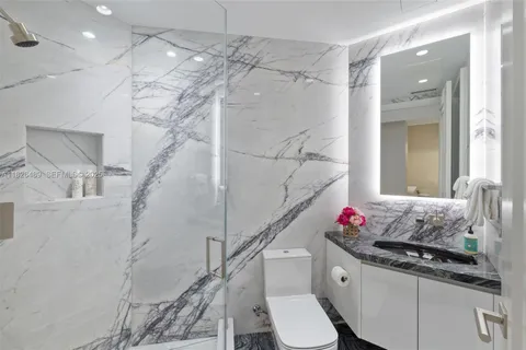a view of bathroom with washer and dryer