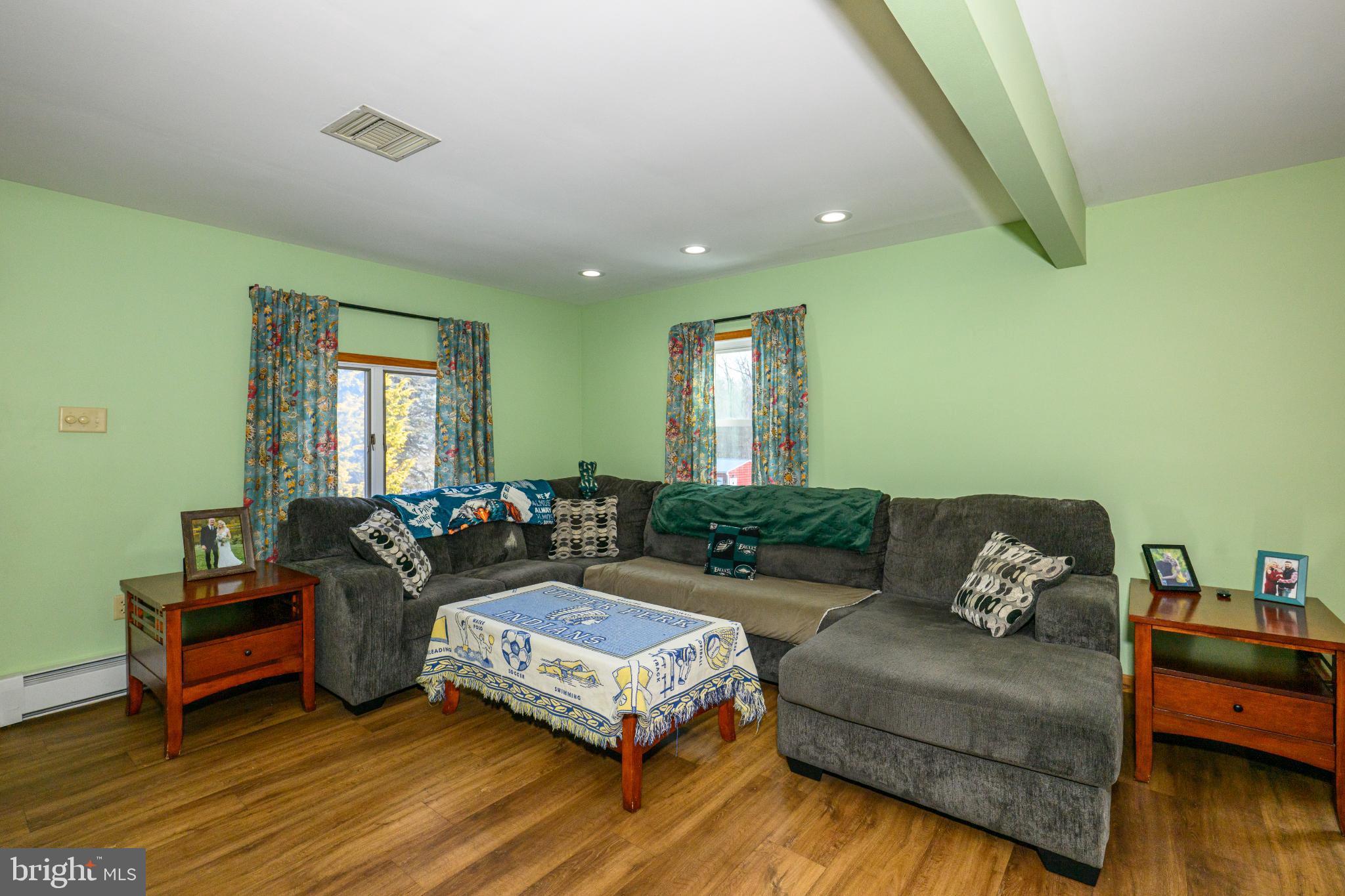 2013 Walters Road Green Lane, PA 18054 - Photo 9 of 26 Cozy living space with vibrant green walls.