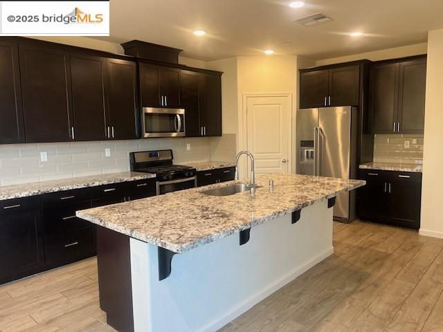 5464 Gallier Loop Antioch, CA 94531 - Photo 3 of 11 a kitchen with stainless steel appliances granite countertop a sink stove and refrigerator