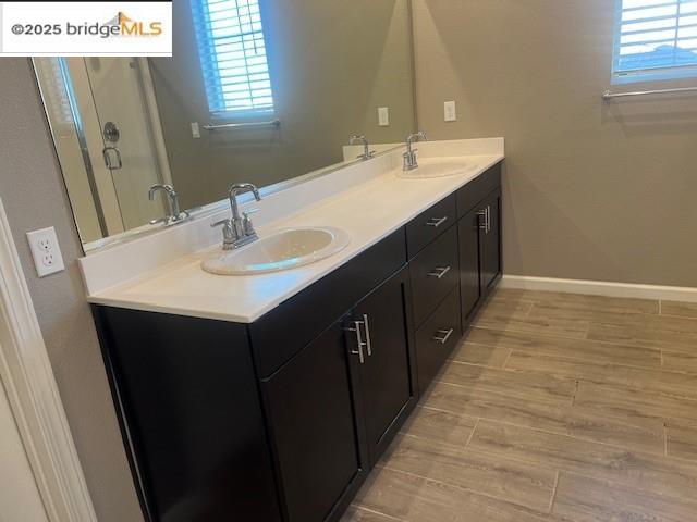 5464 Gallier Loop Antioch, CA 94531 - Photo 9 of 11 a bathroom with double sink and mirror