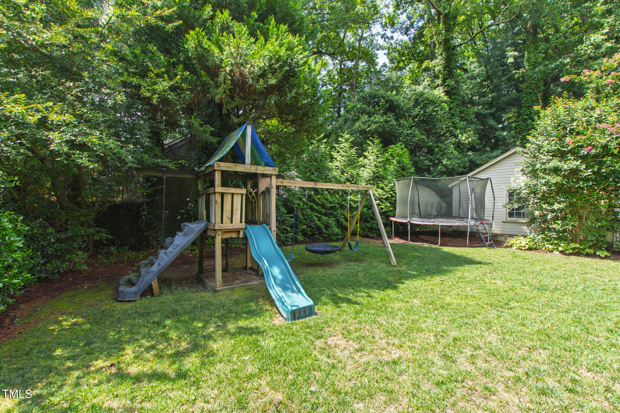 2328 Byrd Street Raleigh, NC 27608 - Photo 8 of 44 swing set and trampoline