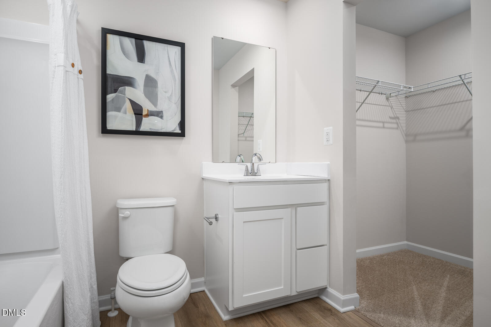 1233 Rollman Farm Road Raleigh, NC 27603 - Photo 18 of 24 a bathroom with a toilet sink and mirror