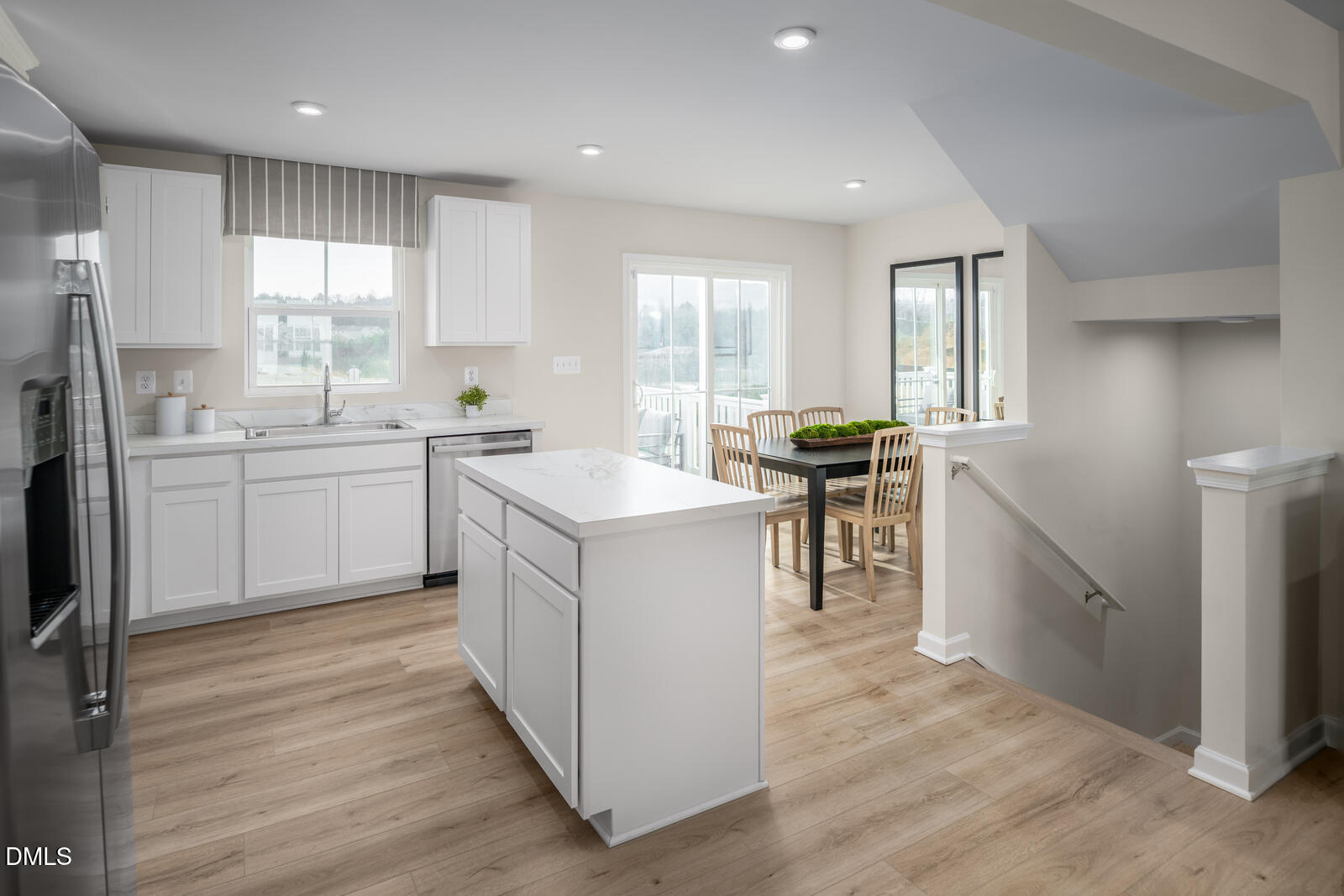 1233 Rollman Farm Road Raleigh, NC 27603 - Photo 6 of 24 a kitchen with a sink stove and cabinets