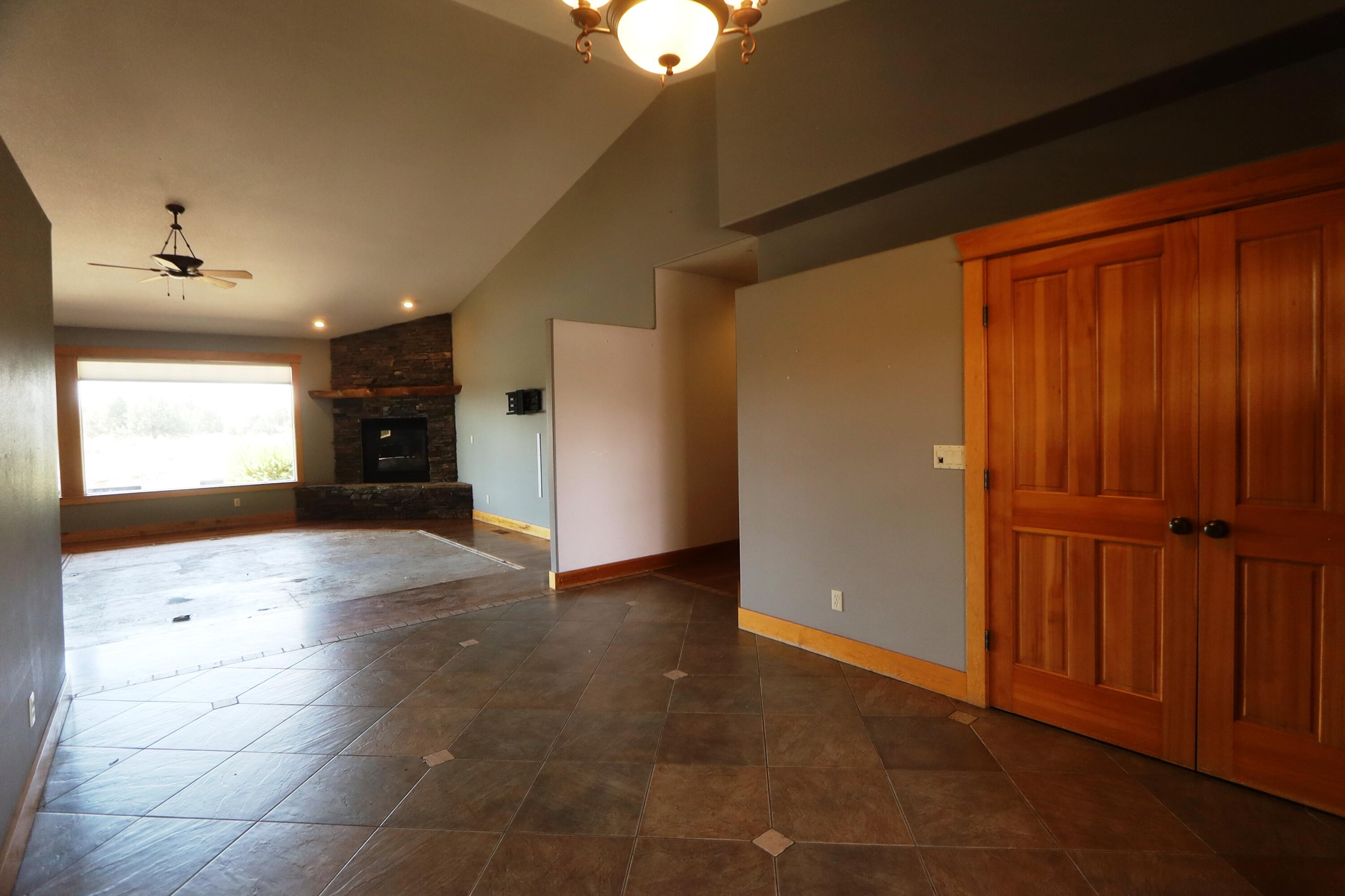 21491 Bear Creek Road Bend, OR 97701 - Photo 7 of 45 a view of an empty room and a window