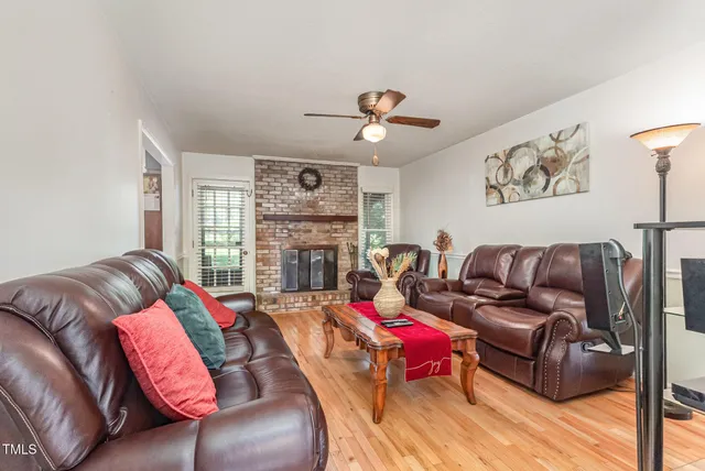 a living room with furniture or couch and a fireplace