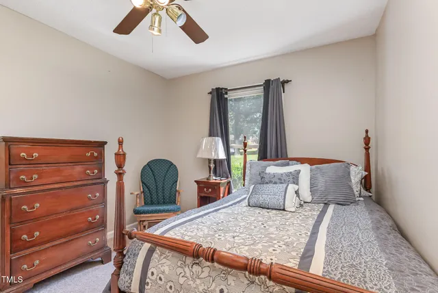 a bathroom with a sink a toilet and a shower curtain