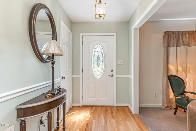 a view of an entryway with wooden floor