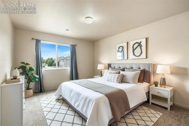 a spacious bathroom with a double vanity sink a large mirror and a shower