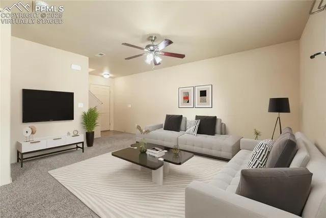 a living room with furniture and a flat screen tv
