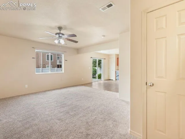 a view of an empty room with a window