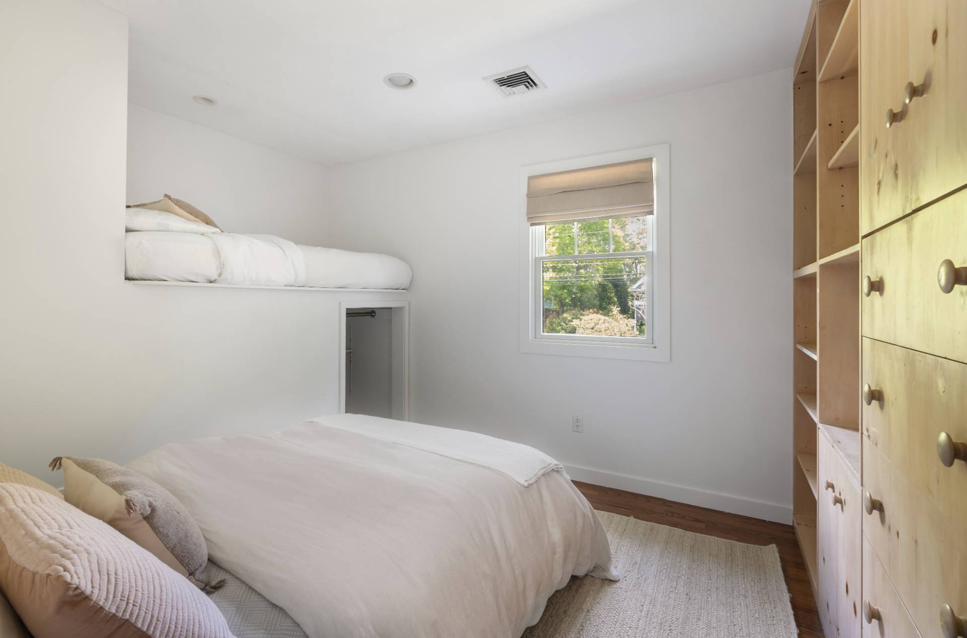 40 Ridge Road West Sag Harbor, NY 11963 - Photo 16 of 27 a bedroom with a bed and a window