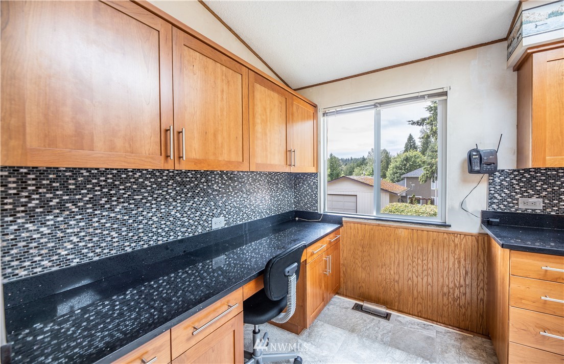 23816 Brier Road Brier, WA 98036 - Photo 15 of 39 a kitchen with granite countertop a sink and a white wooden cabinets