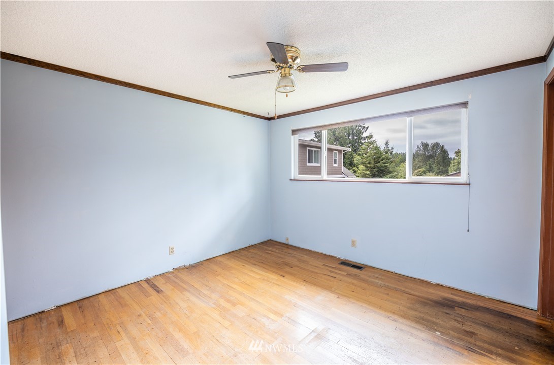 23816 Brier Road Brier, WA 98036 - Photo 22 of 39 a view of a big room with wooden floor and ceiling fan