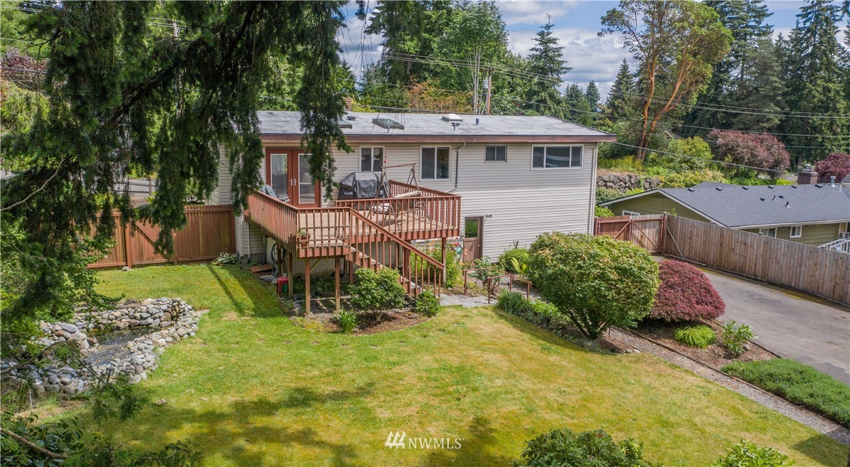 23816 Brier Road Brier, WA 98036 - Photo 26 of 39 a view of a house with a yard and sitting area