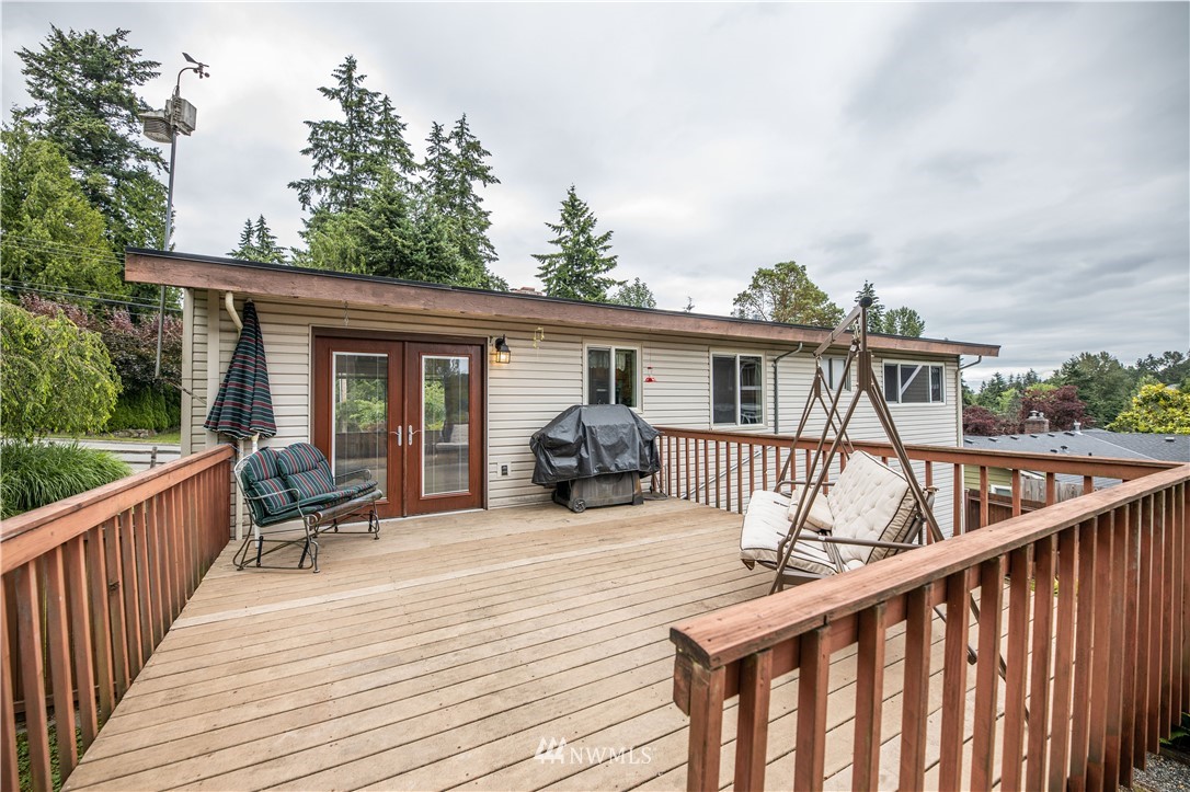 23816 Brier Road Brier, WA 98036 - Photo 28 of 39 a view of a chair and tables on the deck