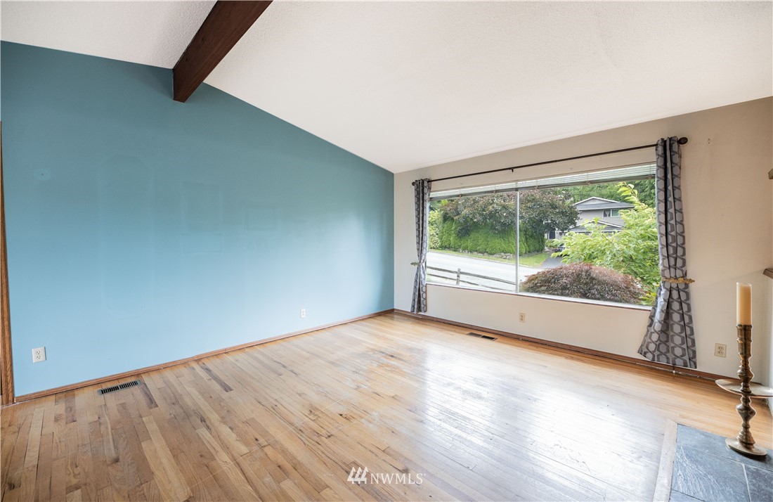 23816 Brier Road Brier, WA 98036 - Photo 9 of 39 a view of an empty room with wooden floor and a window