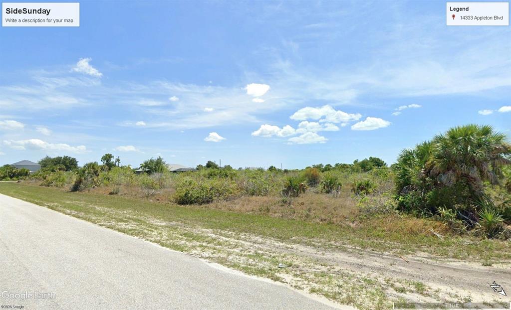 14333 Appleton Boulevard Port Charlotte, FL 33981 - Photo 5 of 5 a view of a lake with a yard