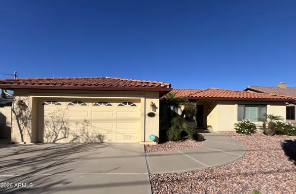 a view of a house with a space and a patio