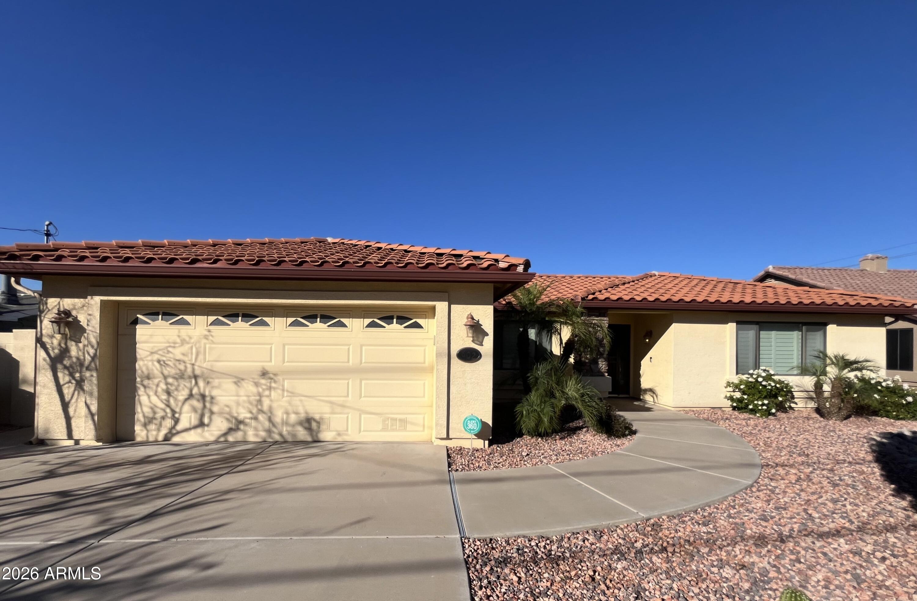 a view of a house with a space and a patio