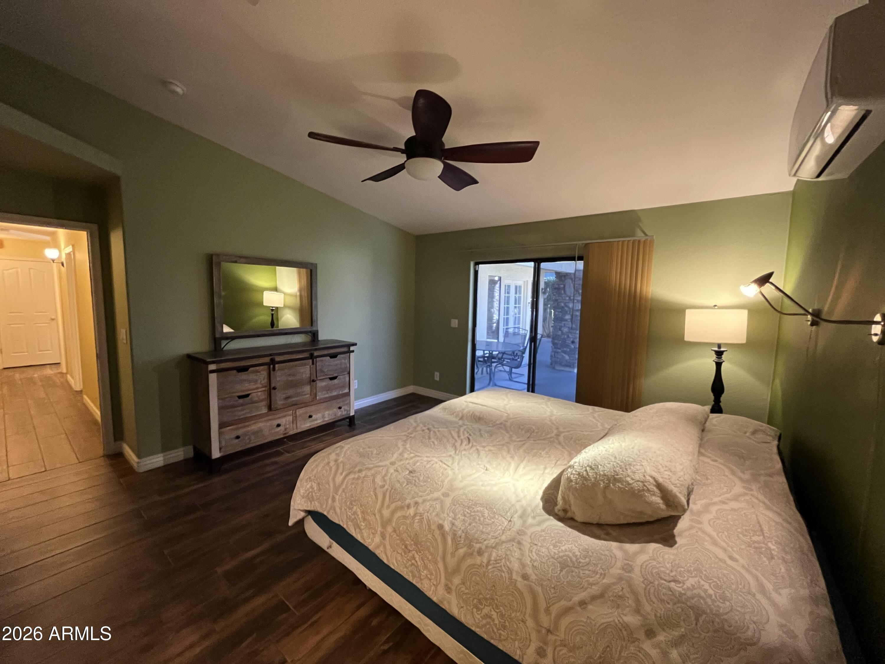802 East Roberts Road Phoenix, AZ 85022 - Photo 13 of 33 a bedroom with a bed and a flat tv screen on dresser