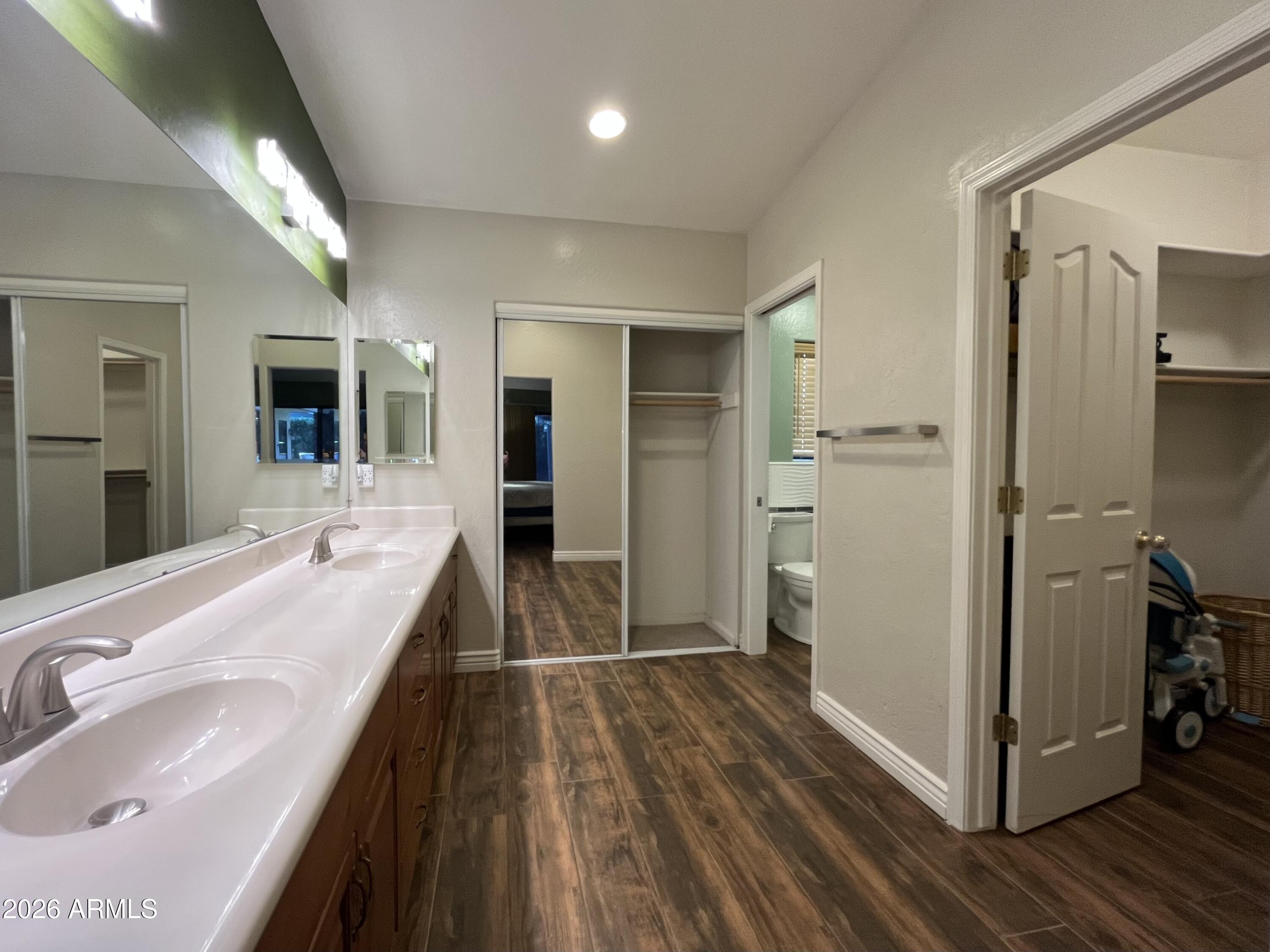 802 East Roberts Road Phoenix, AZ 85022 - Photo 14 of 33 a bathroom with a sink and a mirror