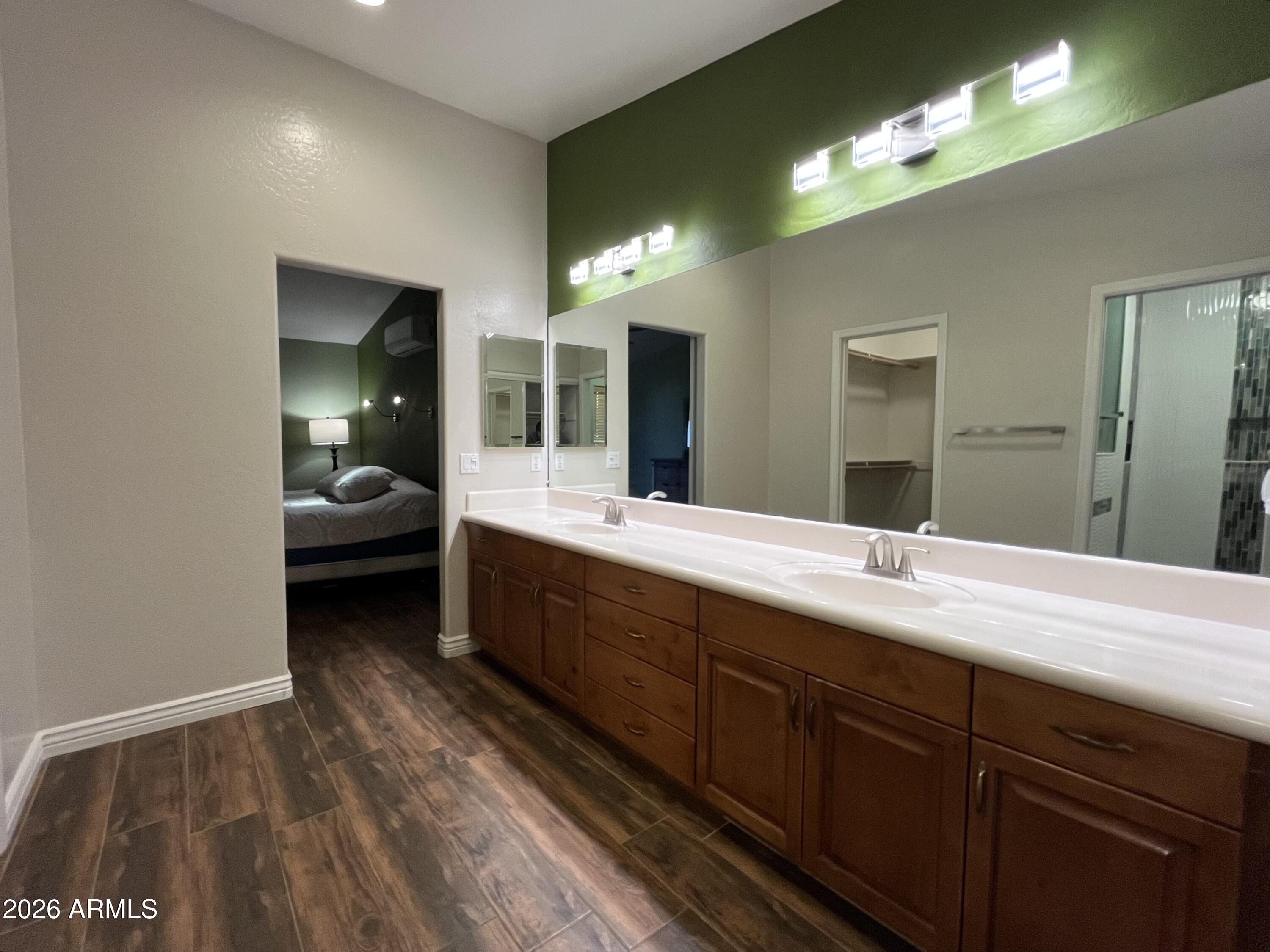 802 East Roberts Road Phoenix, AZ 85022 - Photo 15 of 33 a en suite bathroom with a sink and a large mirror