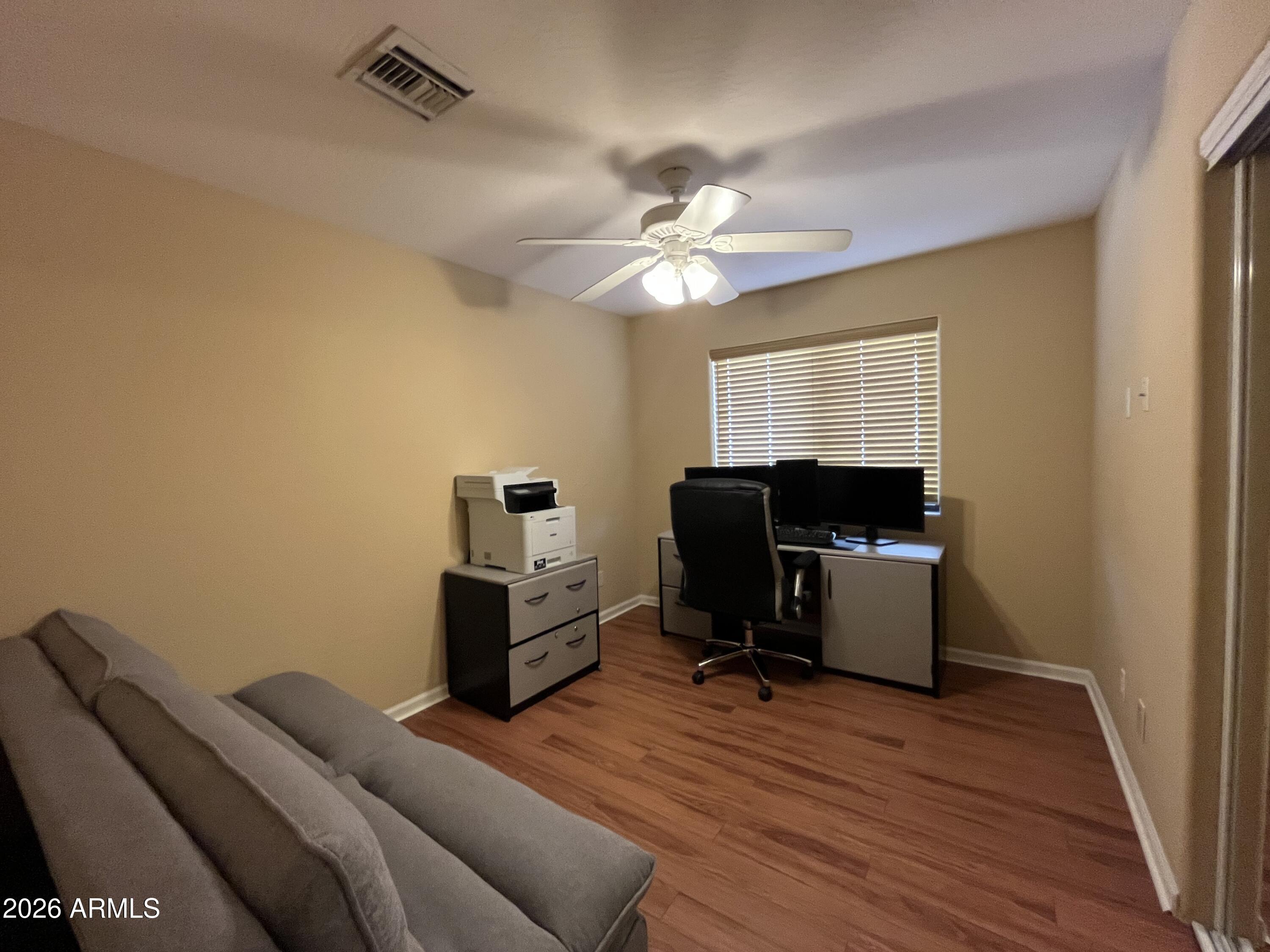 802 East Roberts Road Phoenix, AZ 85022 - Photo 19 of 33 a bedroom with a workspace