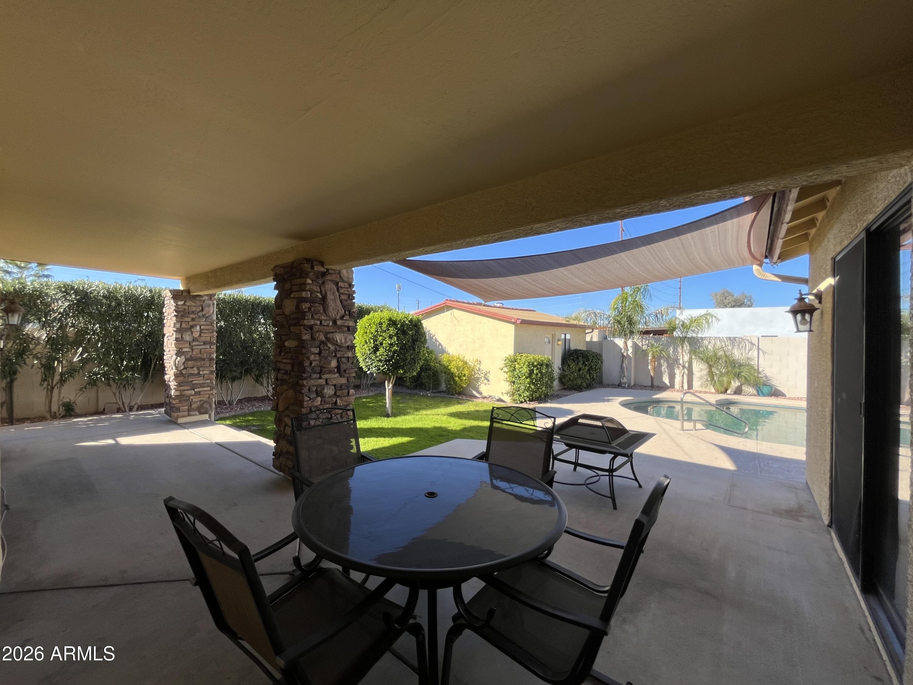 802 East Roberts Road Phoenix, AZ 85022 - Photo 25 of 33 a view of a dining room with furniture window and outside view