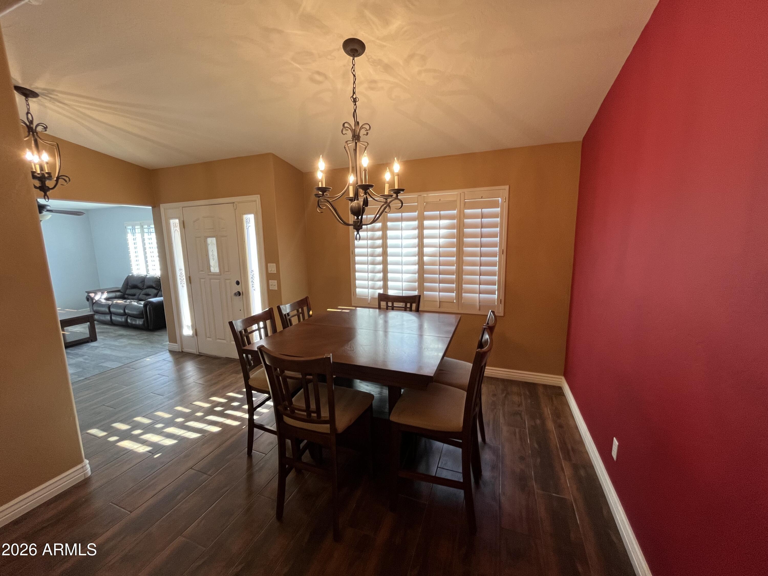 802 East Roberts Road Phoenix, AZ 85022 - Photo 3 of 33 a view of a dining room with furniture and wooden floor