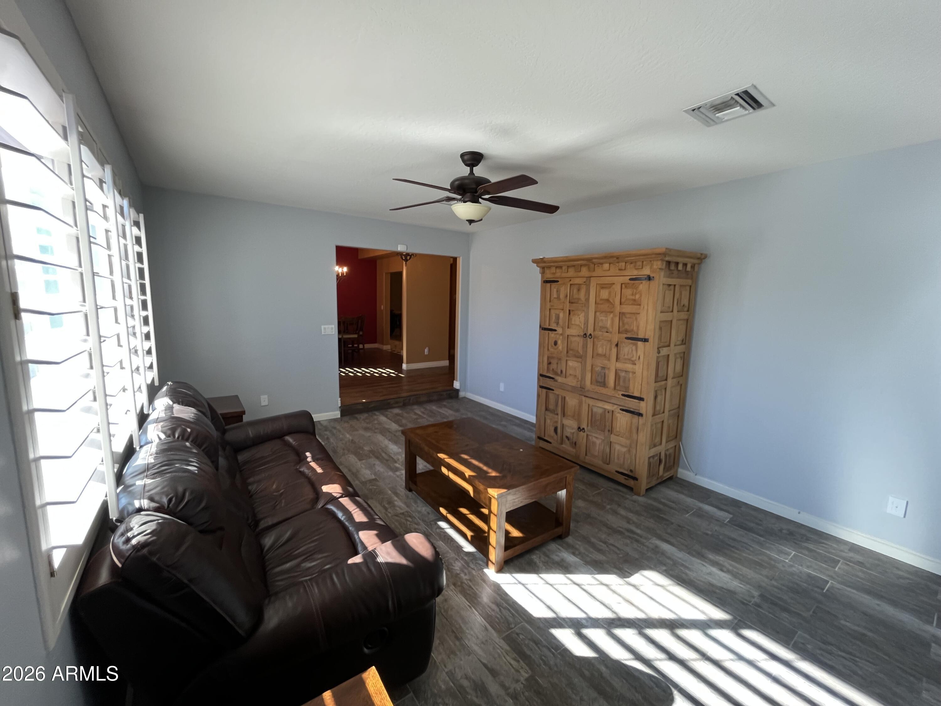 802 East Roberts Road Phoenix, AZ 85022 - Photo 6 of 33 a living room with furniture and a chandelier