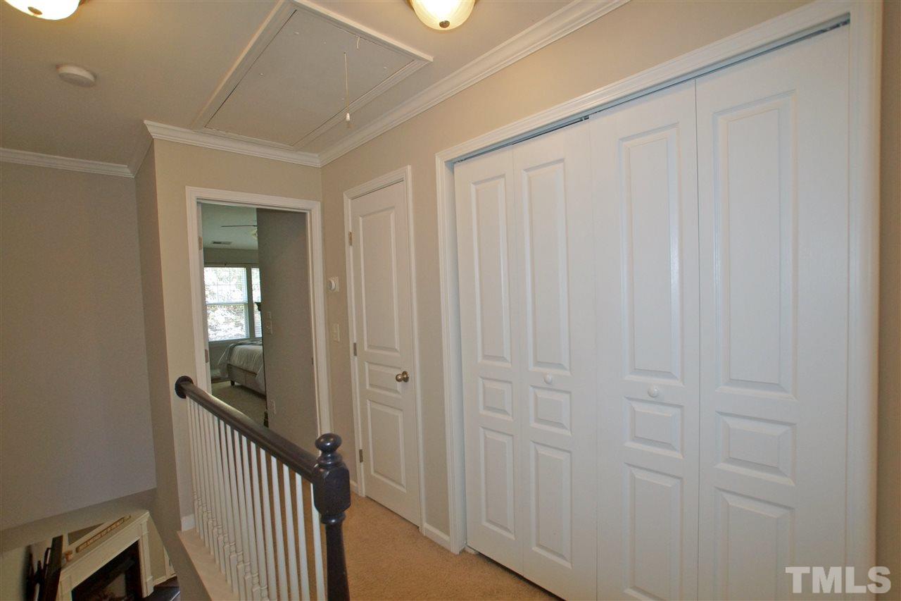 4807 Sir Duncan Way Raleigh, NC 27612 - Photo 19 of 29 a view of a hallway with wooden floor and entryway