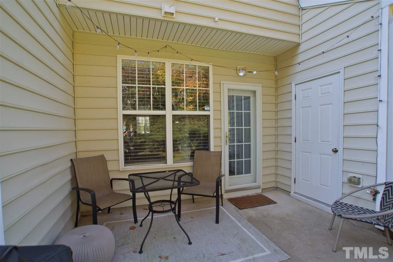4807 Sir Duncan Way Raleigh, NC 27612 - Photo 27 of 29 a balcony with chairs and a potted plant