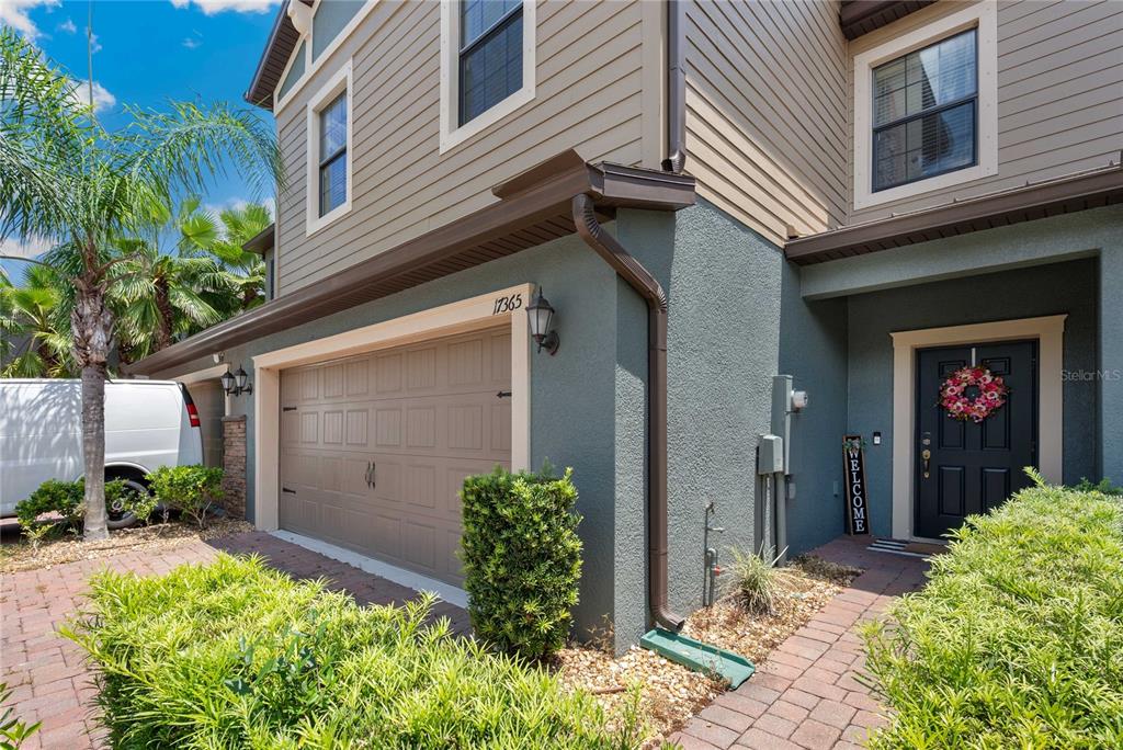 17365 Old Tobacco Road Lutz, FL 33558 - Photo 2 of 44 a view of a house with potted plants