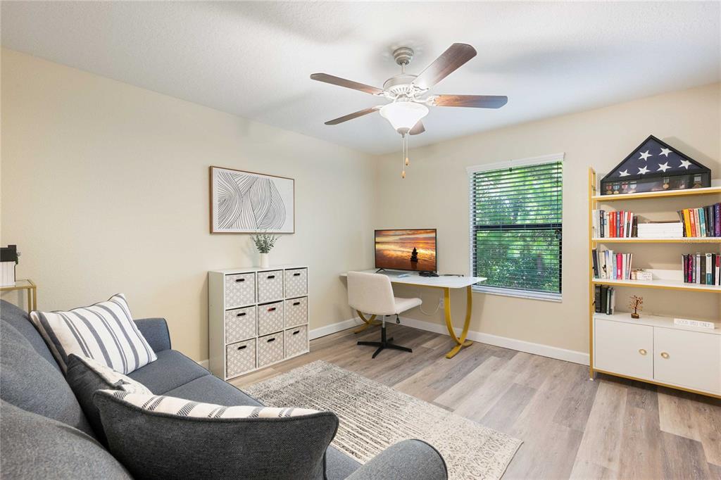 17365 Old Tobacco Road Lutz, FL 33558 - Photo 31 of 44 a living room with furniture and a flat screen tv